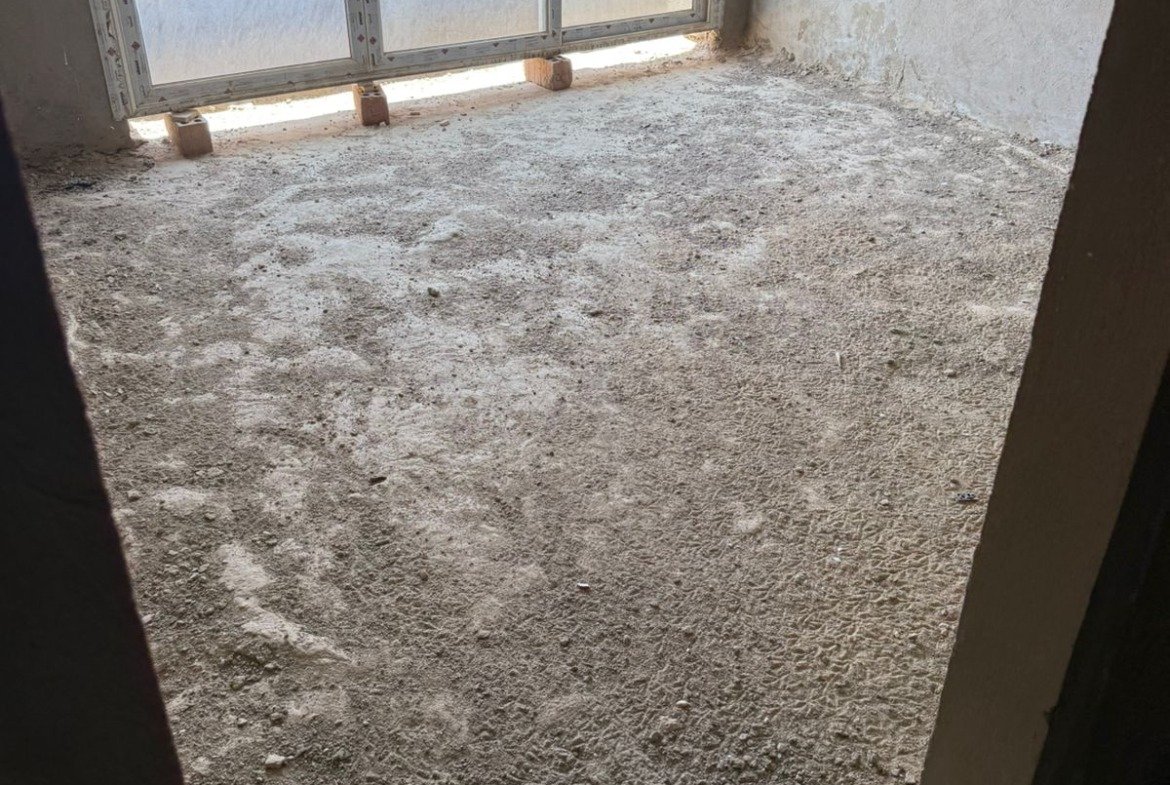 Unfinished living room with large window - apartment in Fifth Square, New Cairo