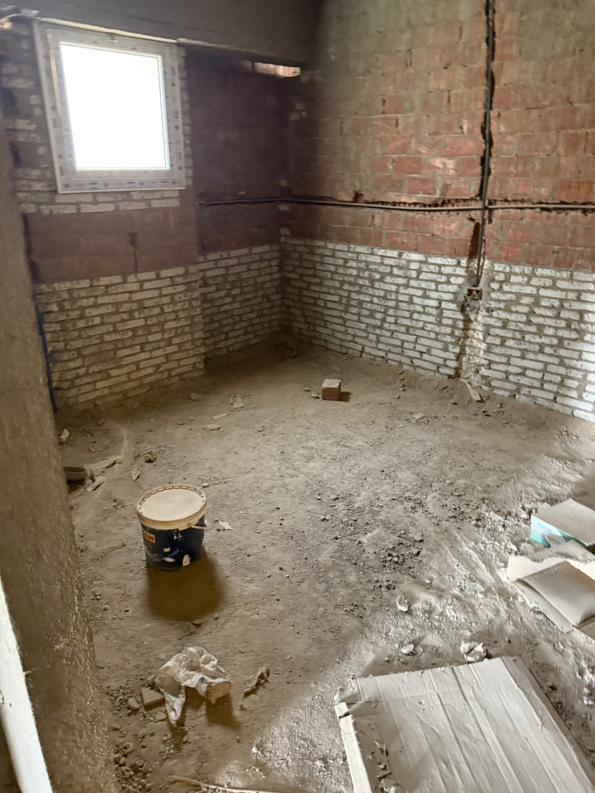 Unfinished room with brick wall and window - apartment in Fifth Square, New Cairo