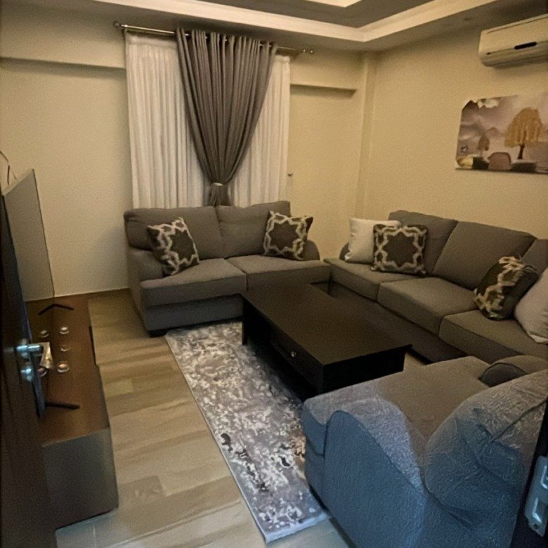 Furnished reception with corner sofa and gypsum ceiling, apartment for sale in Eazy Life New Cairo - شقة للبيع في ايزي لايف القاهرة الجديدة 191-01