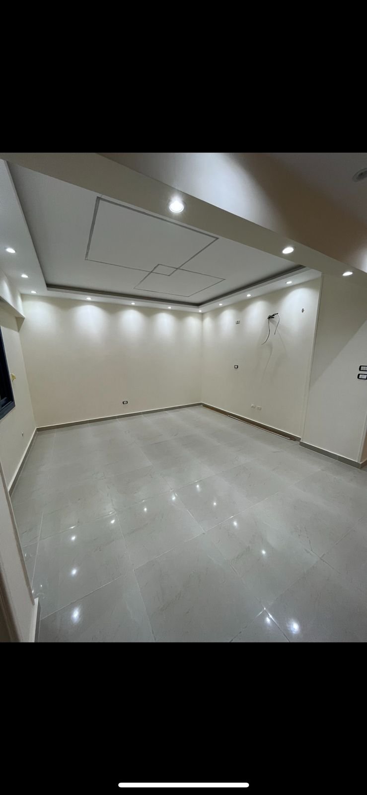 Bright room with a recessed ceiling and a polished floor - apartment in Eazy Life, New Cairo
