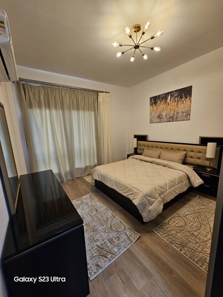 apartment-moon-residences-5th-square-new-cairo-167-sqm-397-bedroom-2 غرفة نوم بسرير مزدوج وستائر - شقة في مون ريزيدنس فيفث سكوير، القاهرة الجديدة