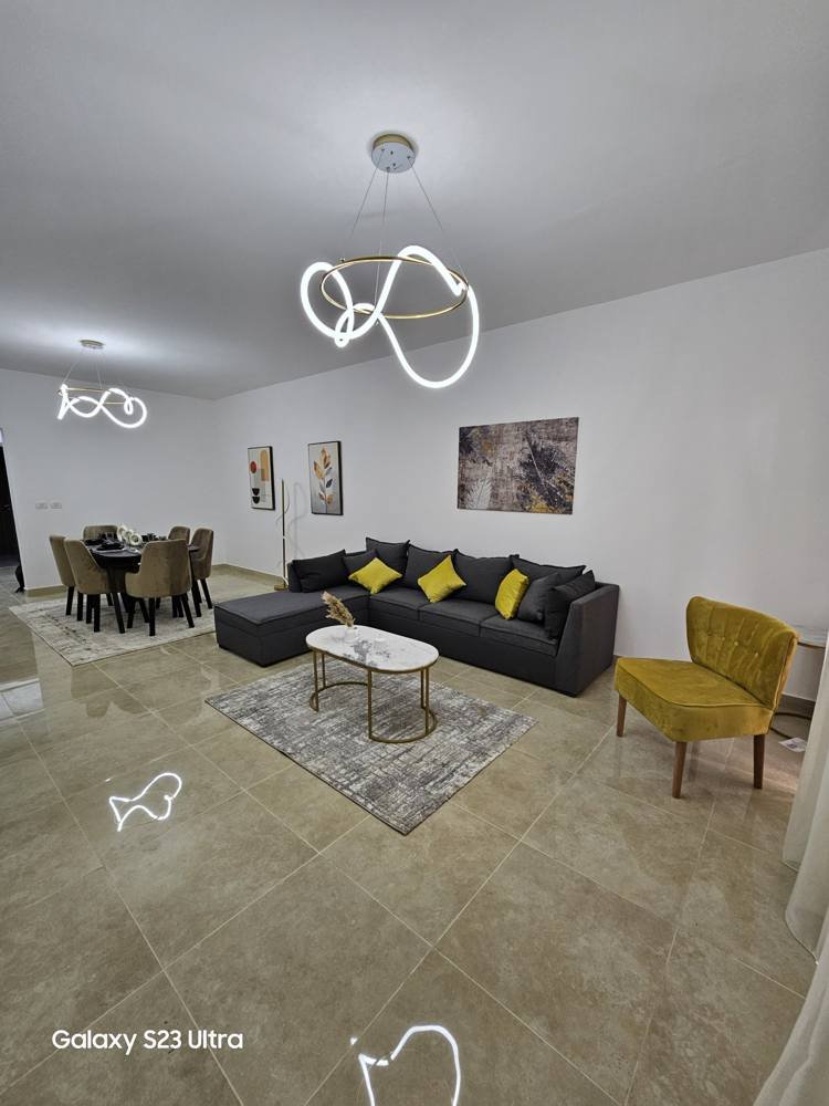 apartment-moon-residences-5th-square-new-cairo-167-sqm-397-reception غرفة معيشة وركن طعام - شقة في مون ريزيدنس فيفث سكوير، القاهرة الجديدة