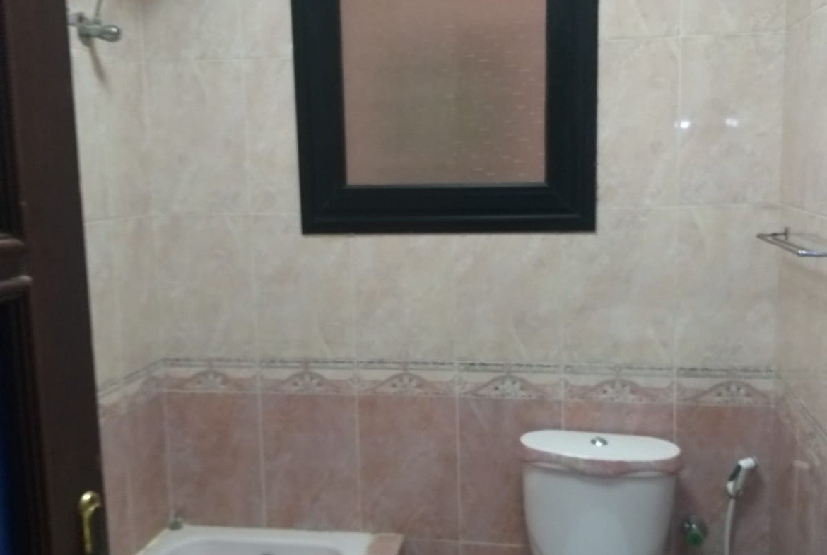 Bathroom with a bathtub, a toilet and a bidet - apartment in Yasmeen 3, New Cairo
