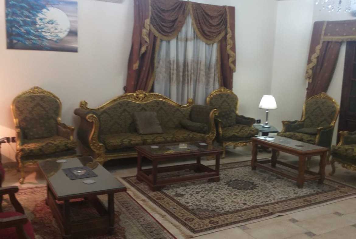 Classic sitting room with a patterned tile floor - apartment in Yasmeen 3, New Cairo