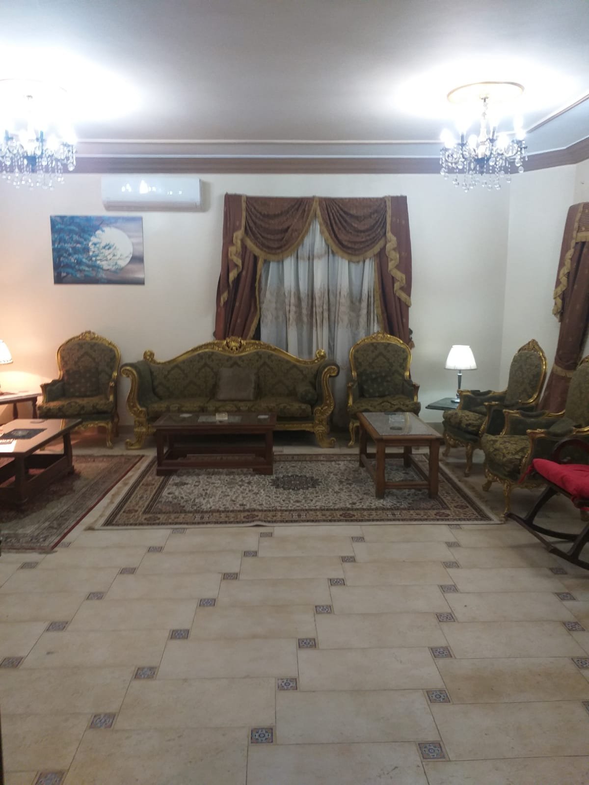 Sitting room with classic armchairs and brown curtains - apartment in Yasmeen 3, New Cairo