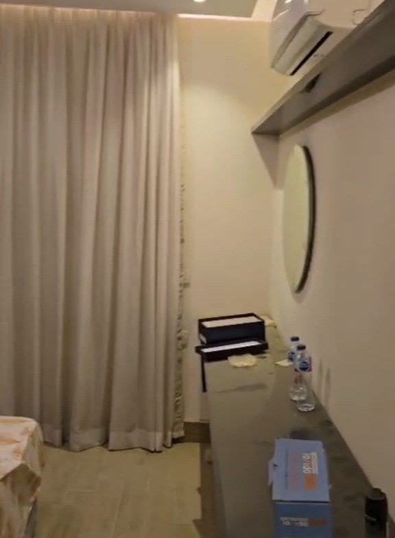 Narrow hallway with curtains and a storage unit - apartment in Taj City, New Cairo