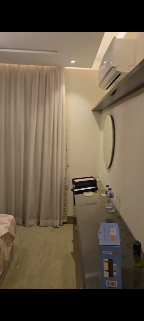 apartment-sale-taj-city-zone-t-36-bedroom-ac Narrow hallway with curtains and a storage unit - apartment in Taj City, New Cairo