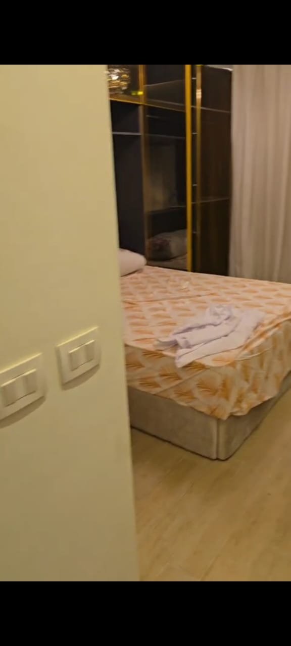 apartment-sale-taj-city-zone-t-36-bedroom Narrow corridor leading to a bedroom - apartment in Taj City, New Cairo
