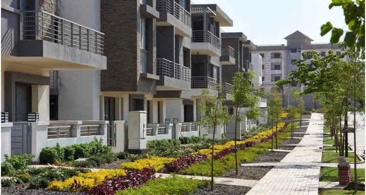 Townhouses along a landscaped walking path - apartment in Taj City, New Cairo