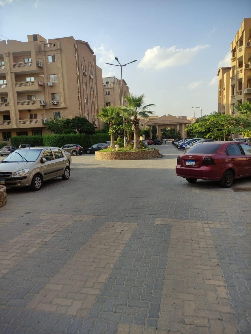 ashrafeya-residence-new-cairo-street-1 Paved parking area in front of apartment blocks - apartment in Ashrafeya Residence, New Cairo