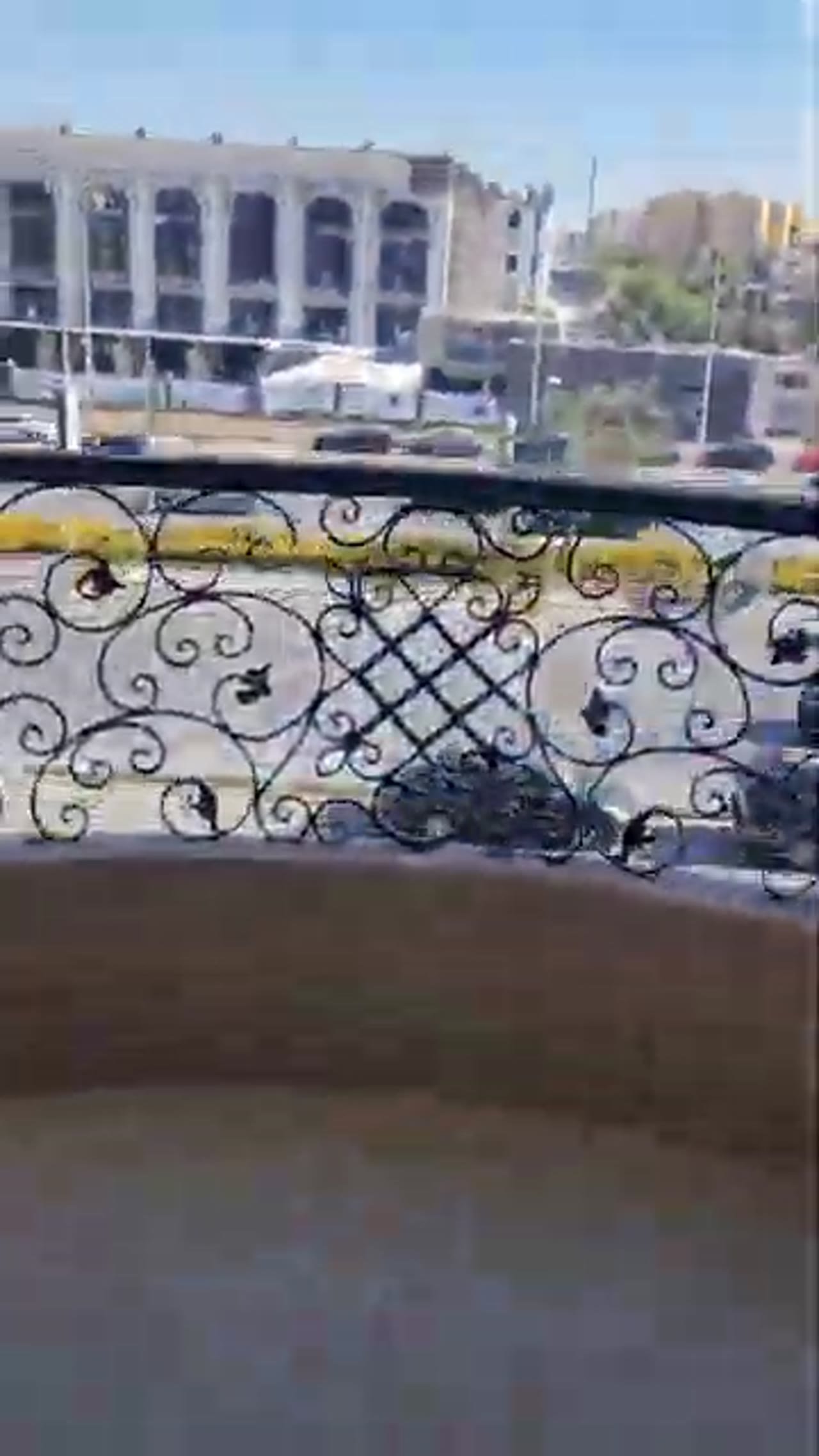 Balcony with an ornate iron railing and a building opposite - apartment in Al Banafseg New Cairo – 3 Bedrooms 220 sqm Mohamed Naguib St, New Cairo