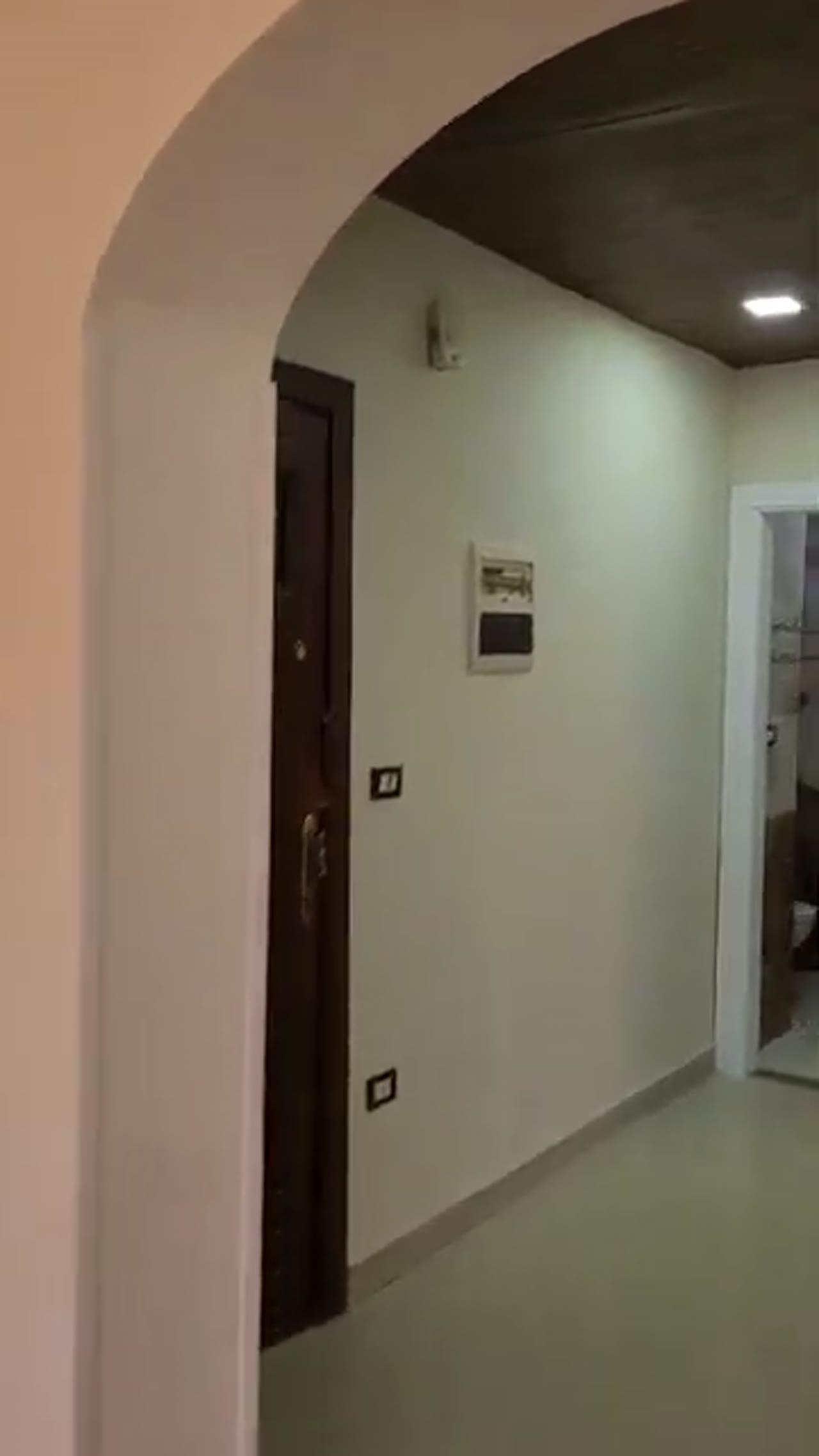 Arched doorway to a hallway with a dark door - apartment in Al Banafseg New Cairo – 3 Bedrooms 220 sqm Mohamed Naguib St, New Cairo