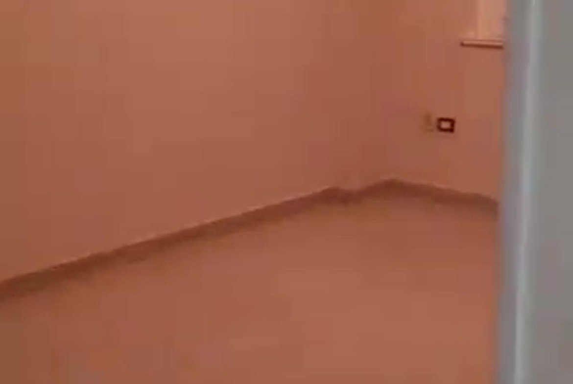 Empty room with salmon-pink walls - apartment in Al Banafseg New Cairo – 3 Bedrooms 220 sqm Mohamed Naguib St, New Cairo