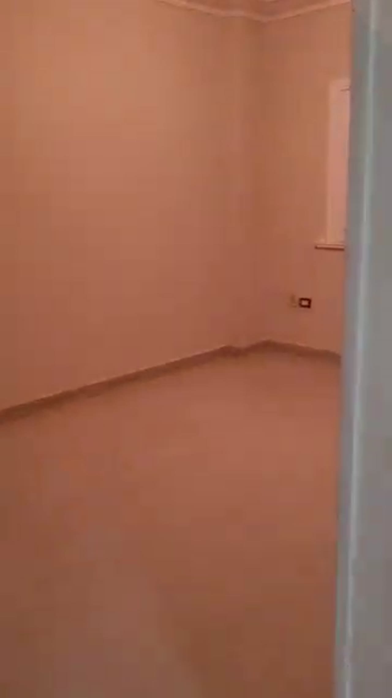 Empty room with salmon-pink walls - apartment in Al Banafseg New Cairo – 3 Bedrooms 220 sqm Mohamed Naguib St, New Cairo