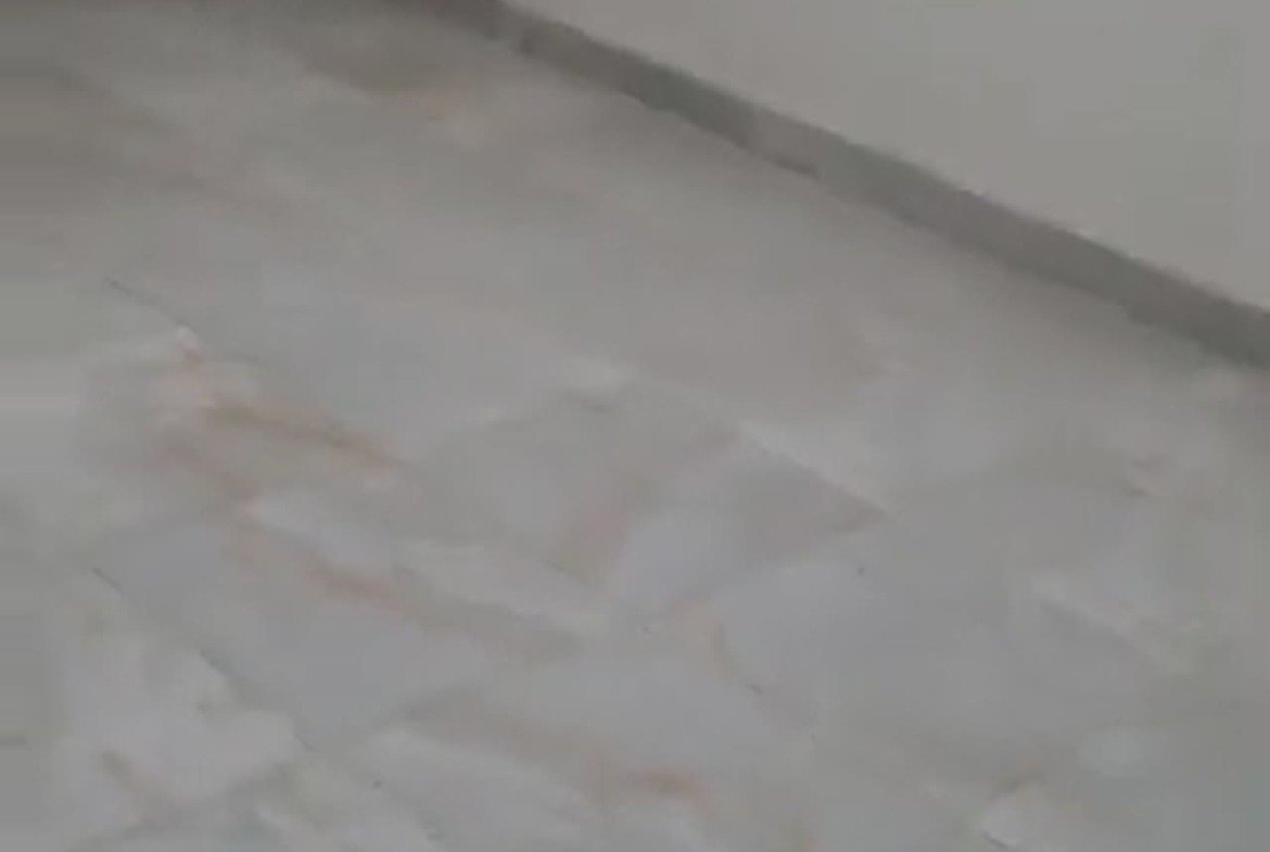 Empty room with light marble-look floor and a white window - apartment in Al Banafseg New Cairo – 3 Bedrooms 220 sqm Mohamed Naguib St, New Cairo