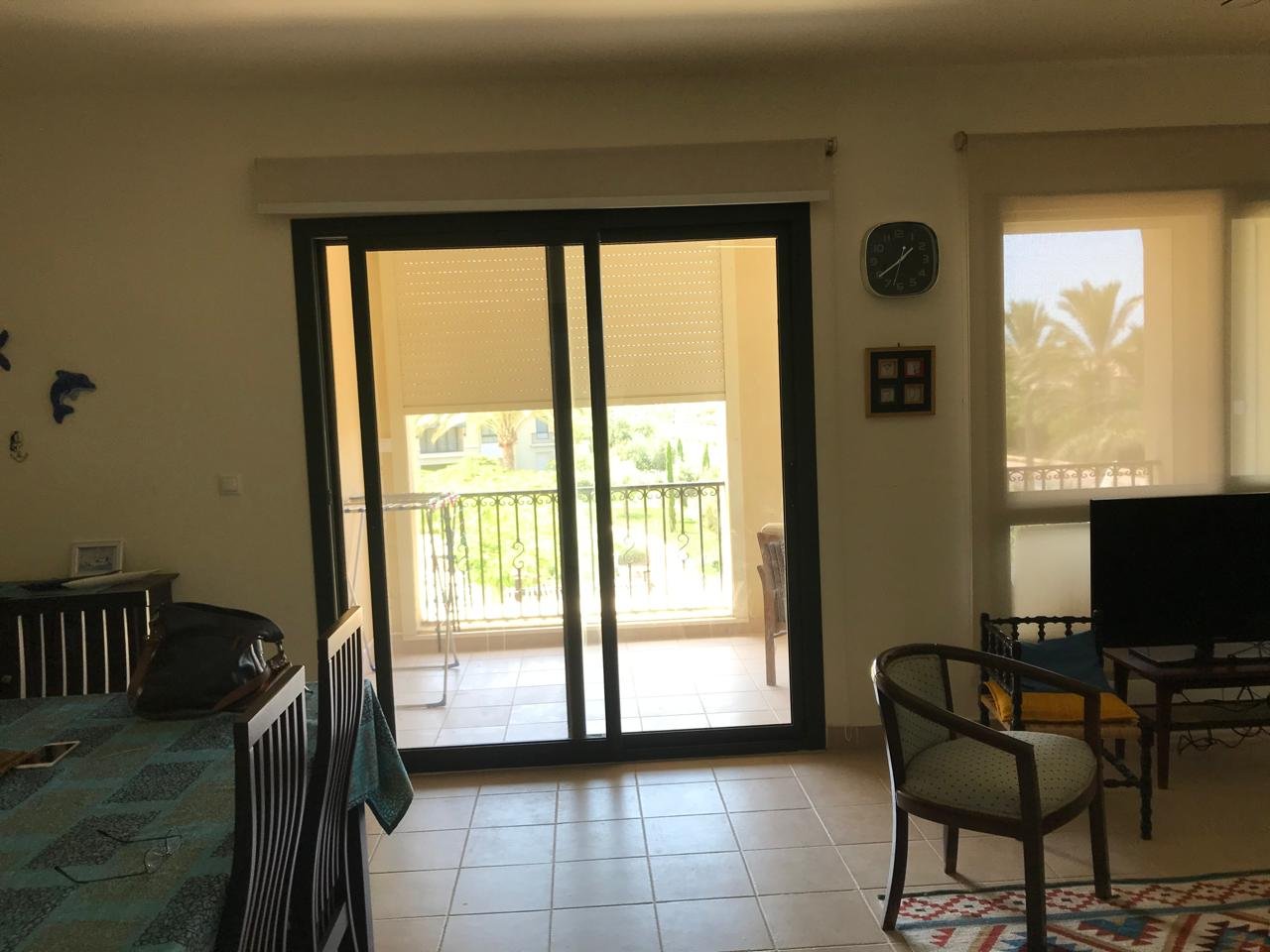 Furnished chalet for sale in Catania Marassi North Coast - living room opening to terrace