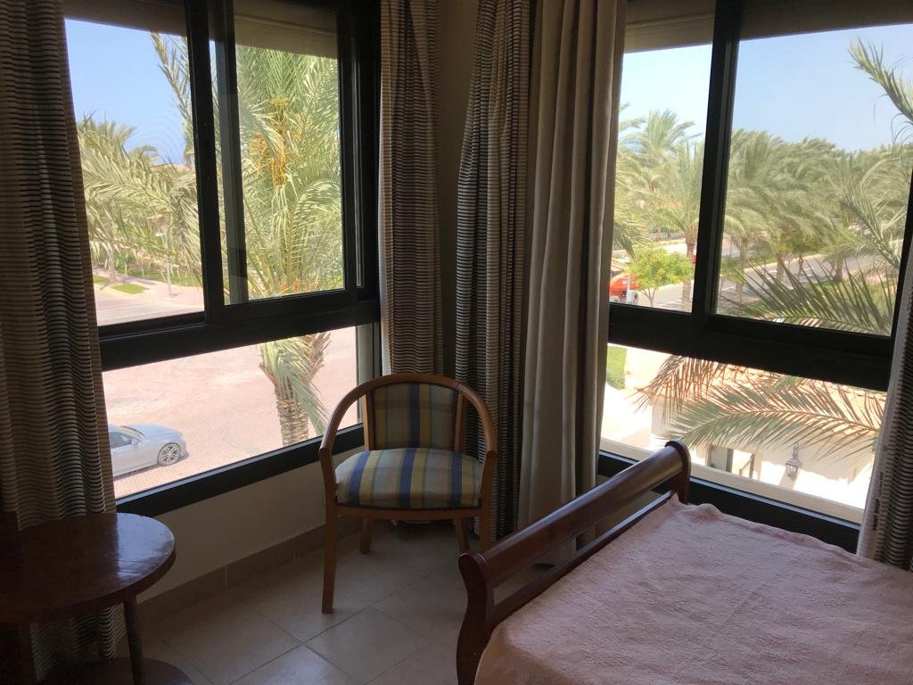 Furnished chalet for sale in Catania Marassi North Coast - bedroom with palm view