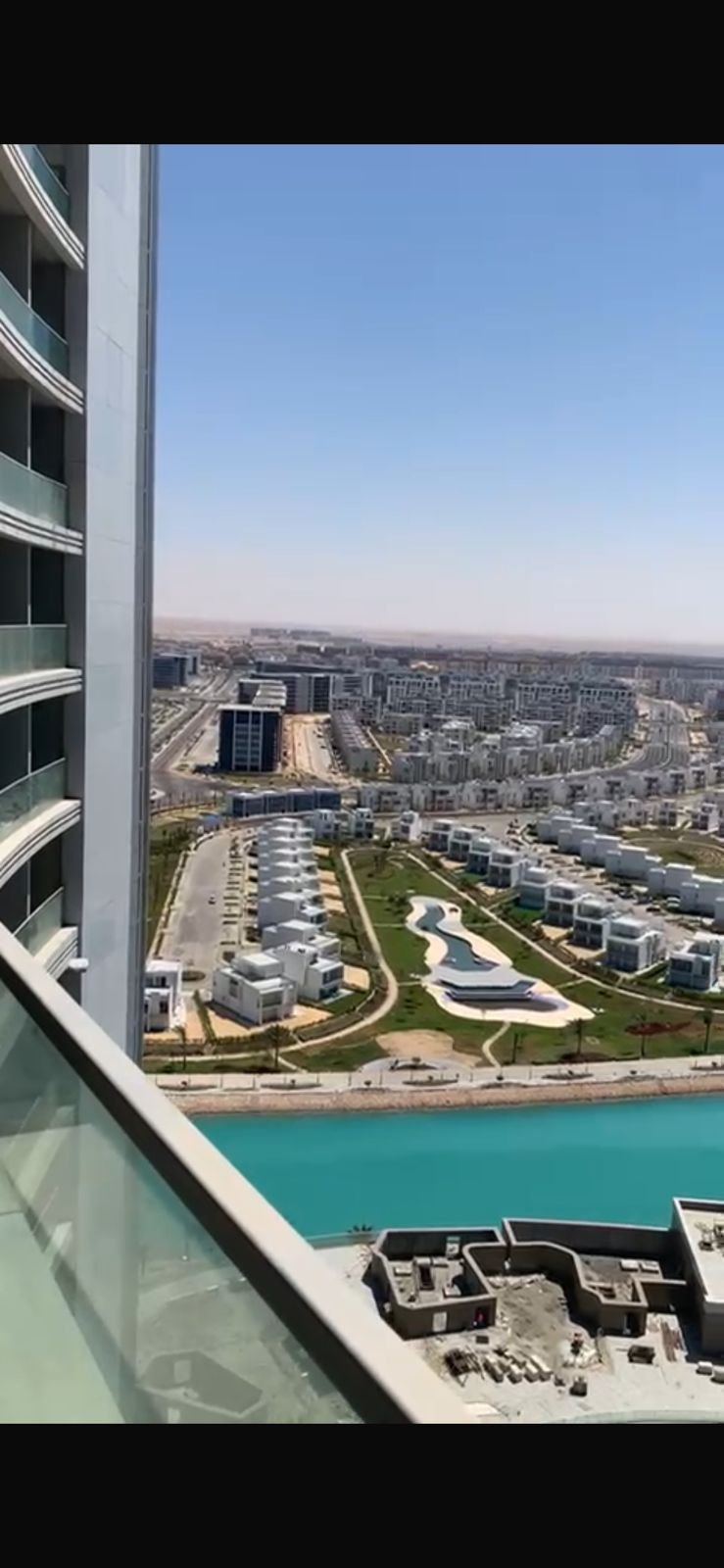 chalet-sale-alam-al-roum-new-alamein-38-city-view إطلالة جوية على لاجونات فيروزية ومبانٍ - شاليه في علم الروم العلمين الجديدة