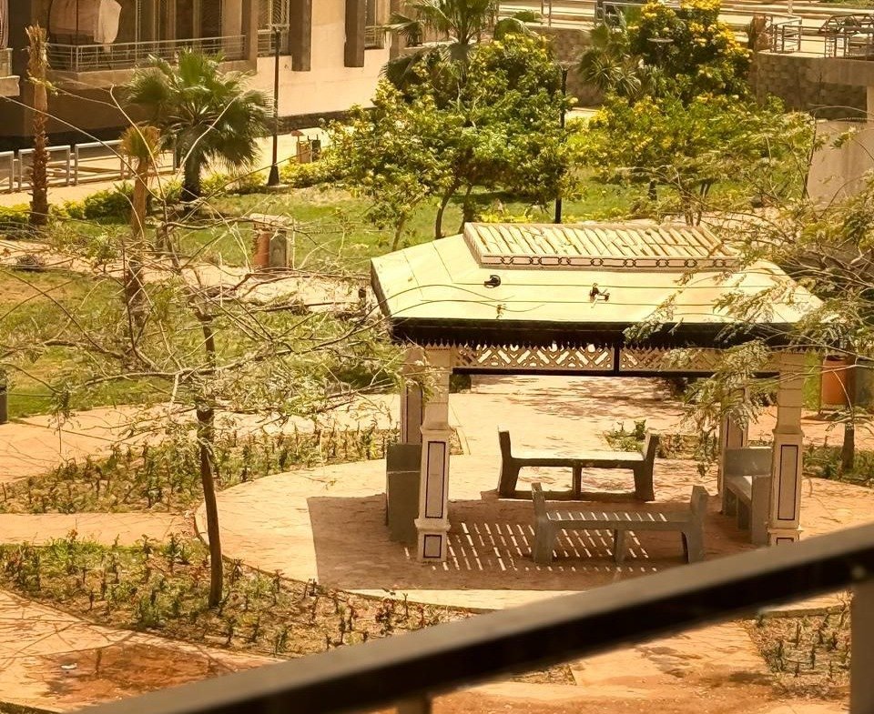 Gazebo and landscaped garden viewed from a terrace - apartment in Dar Misr Al Koronfol New Cairo – 3 Bedrooms 130 sqm, New Cairo