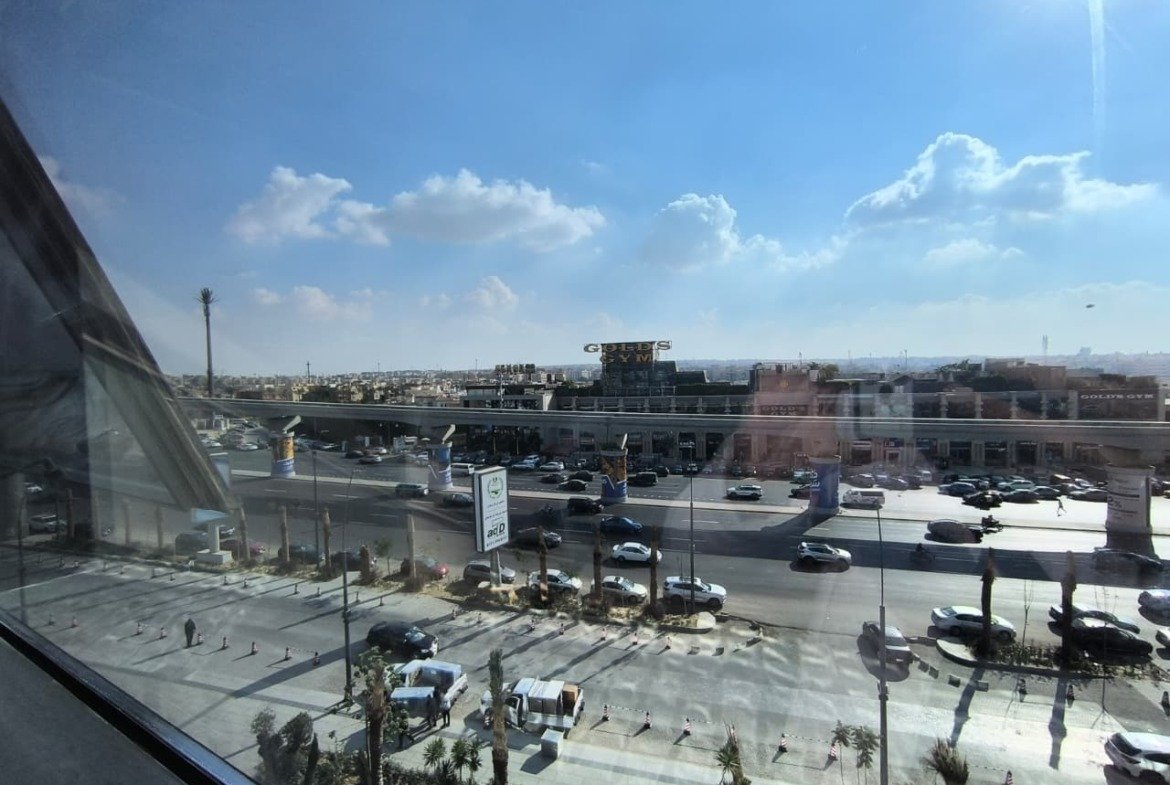 Window view of a main road and parking lots from a high floor - unit in Marassi