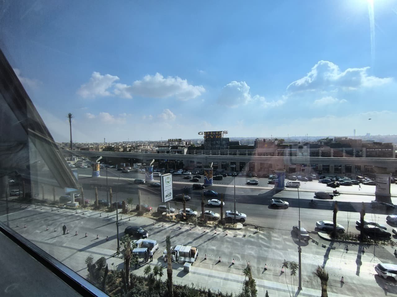 Window view of a main road and parking lots from a high floor - unit in Marassi