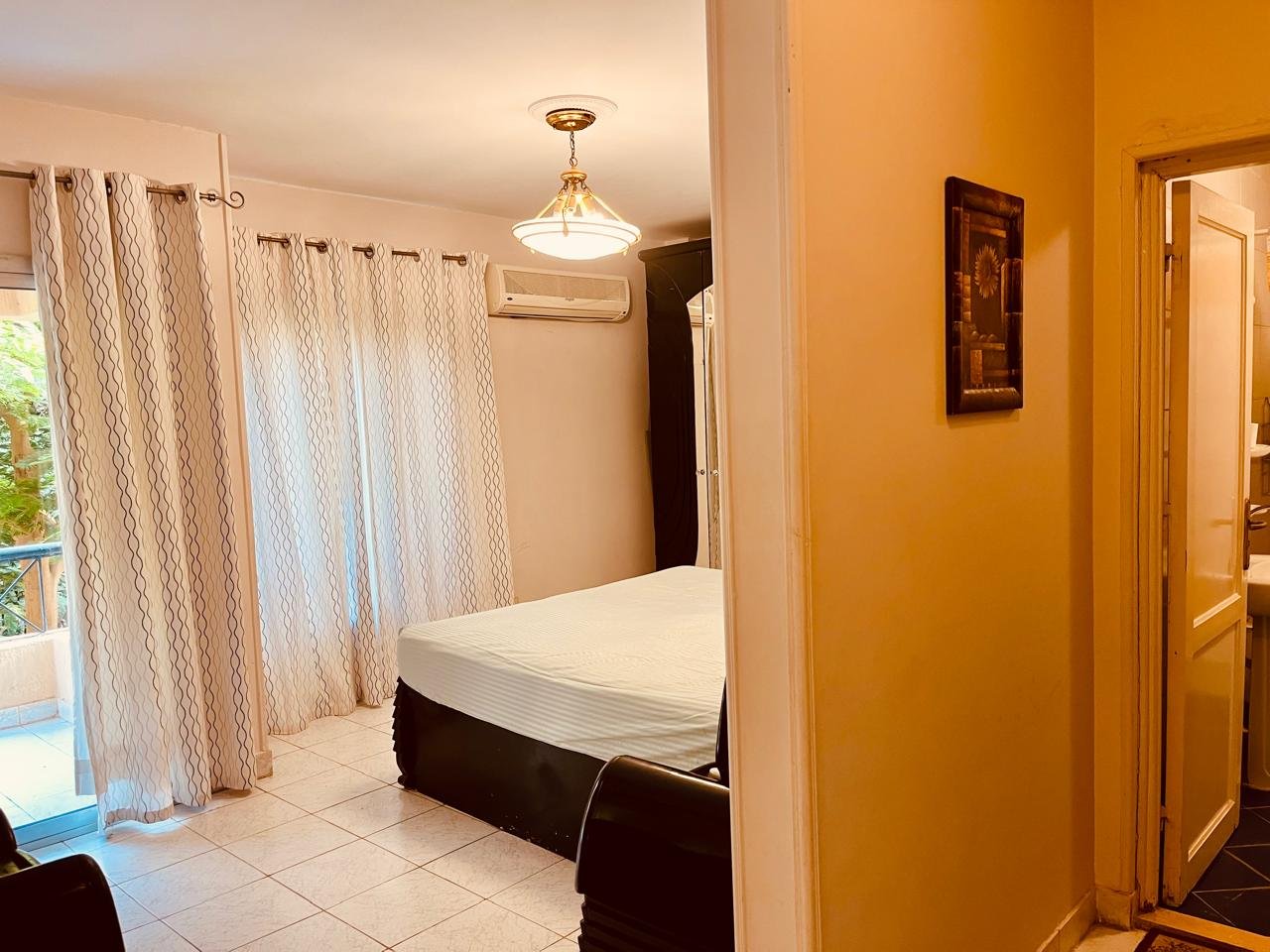 el-rehab-apt-rent-108-05 Bedroom with a ceiling lamp and long curtains - apartment in El Rehab New Cairo – 3 Bedrooms 183 sqm – Garden View, New Cairo