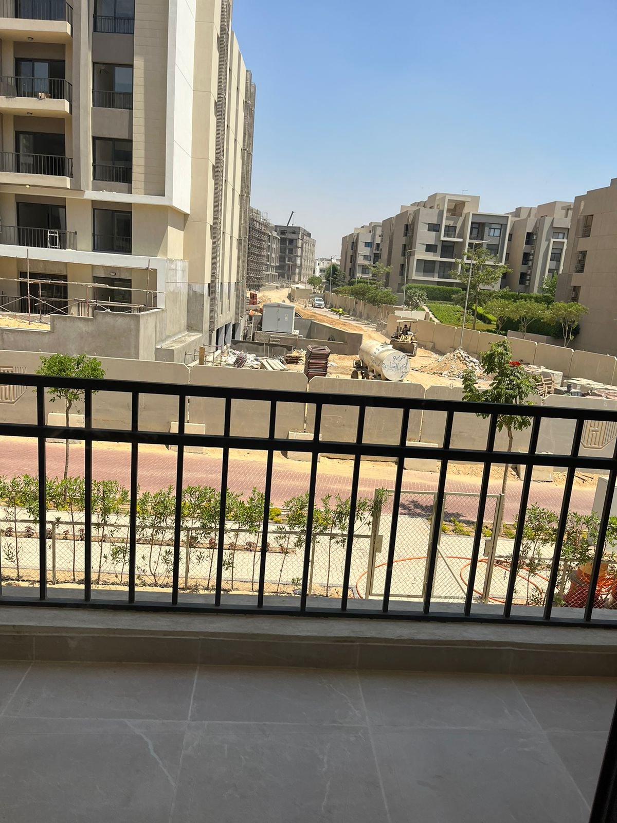 Balcony overlooking the compound buildings - apartment in Fifth Square, New Cairo