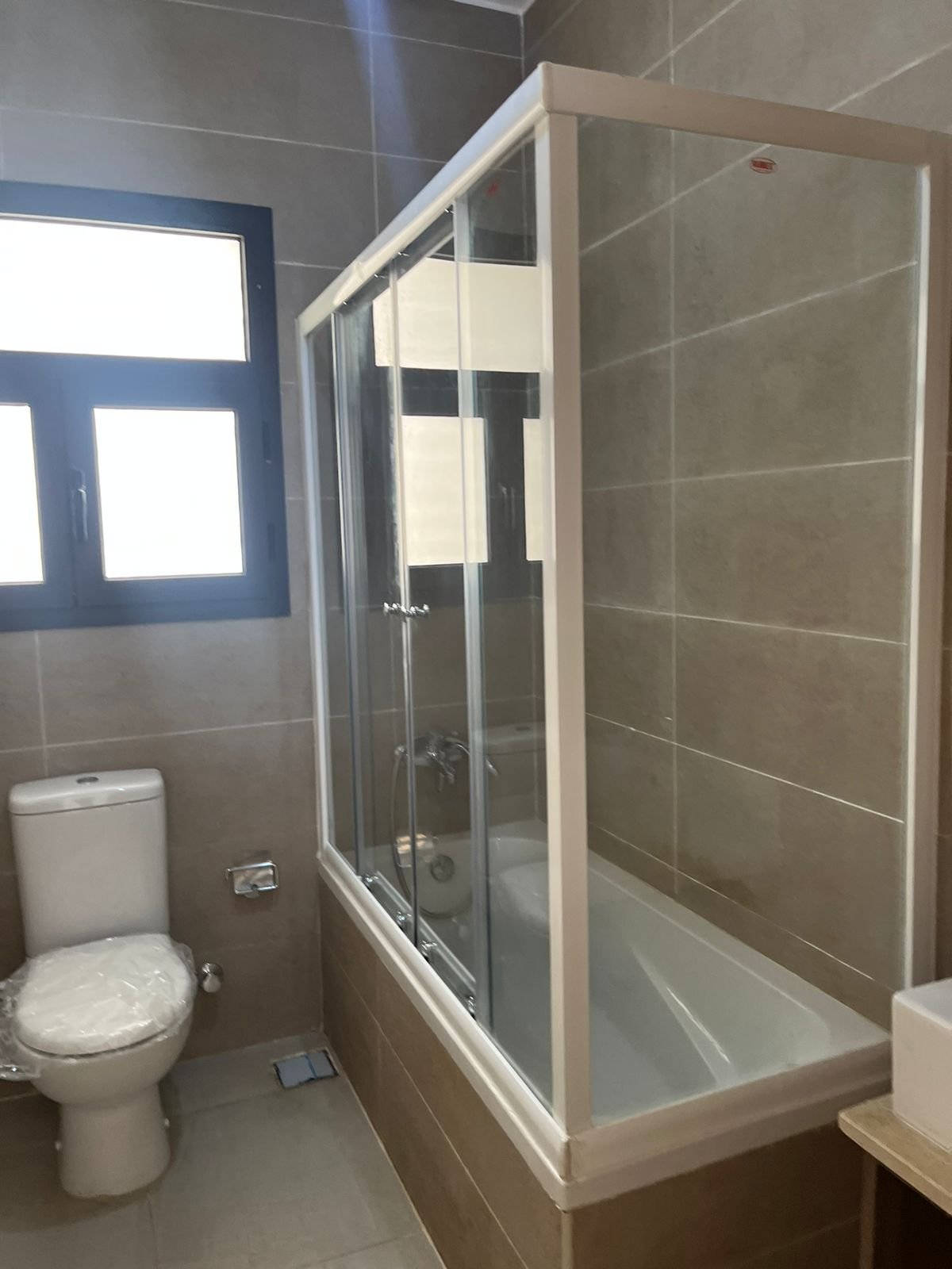 Bathroom with shower cabin and toilet - apartment in Fifth Square, New Cairo