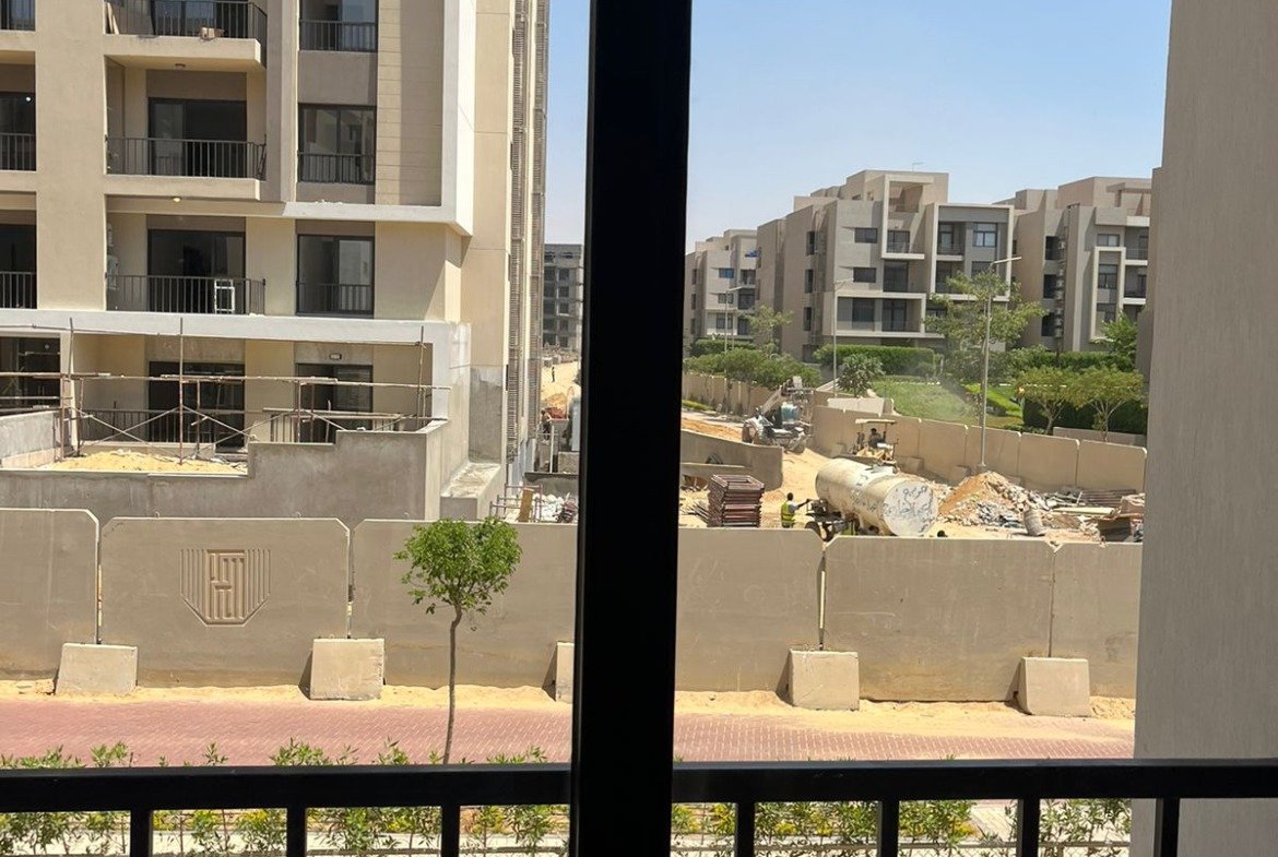Balcony door with view of the buildings - apartment in Fifth Square, New Cairo
