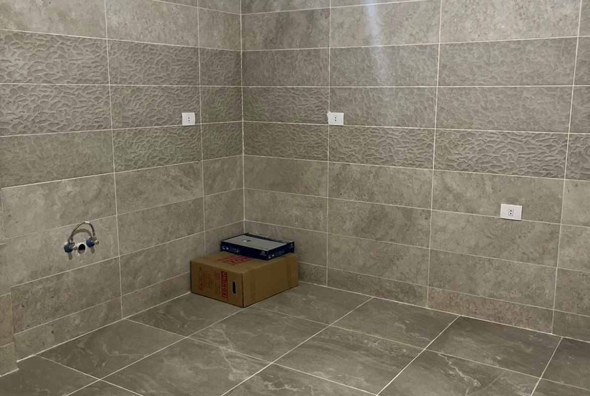 Empty bathroom with grey tiles - apartment in Fifth Square, New Cairo
