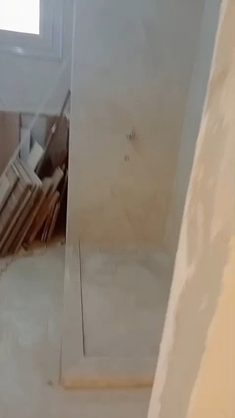Marble-tiled shower with a glass panel - apartment in Mountain View iCity, New Cairo