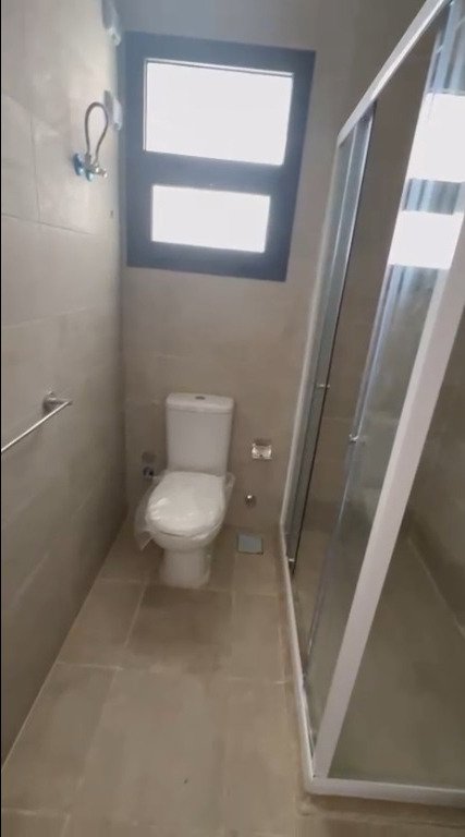 Bathroom with toilet and shower cabin - apartment in Fifth Square, New Cairo