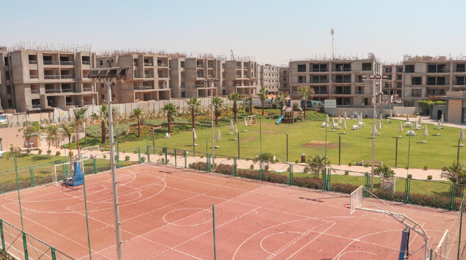 Sports court beside the apartment buildings - apartment in Fifth Square, New Cairo