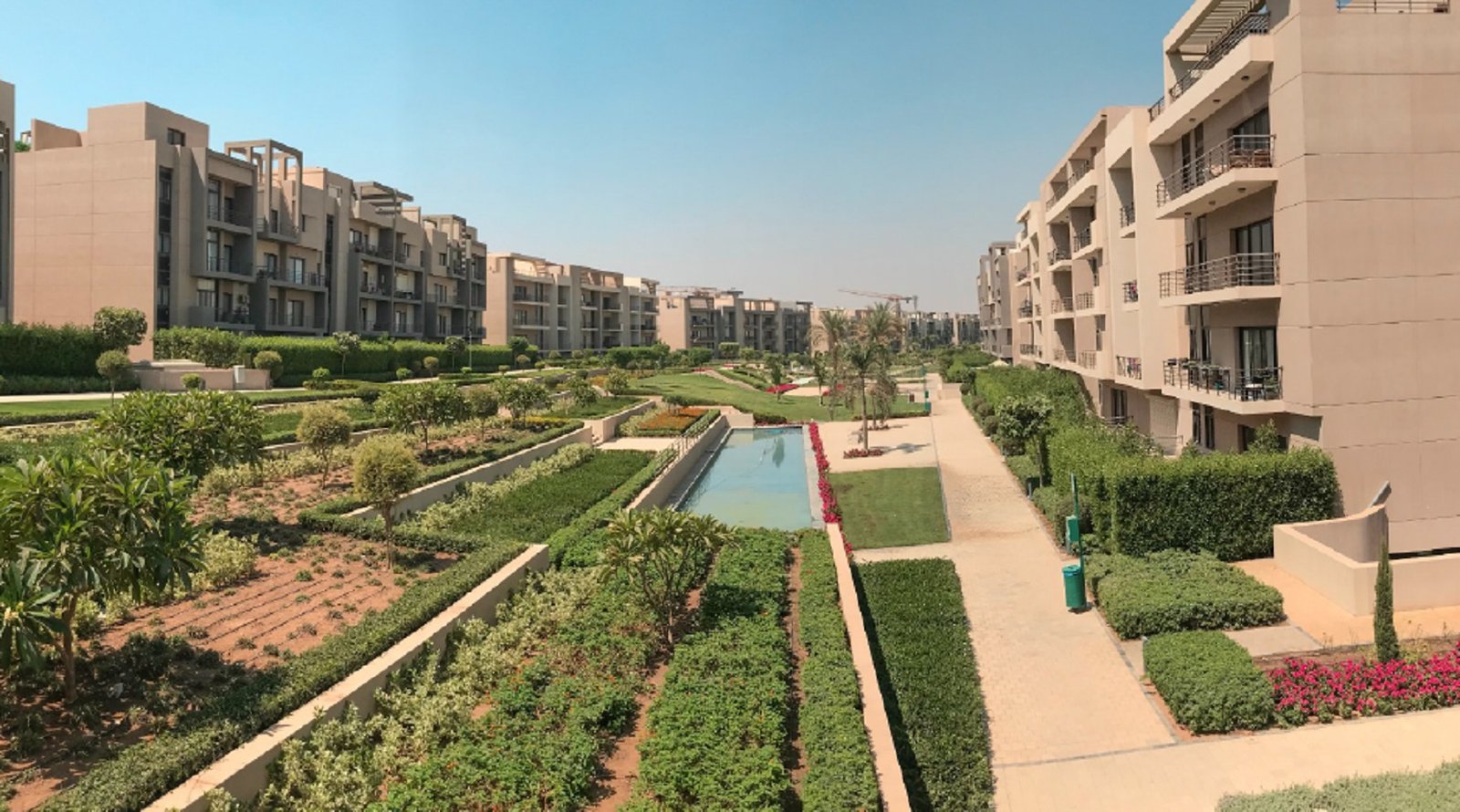 Landscaped gardens and walkways between the buildings - apartment in Fifth Square, New Cairo