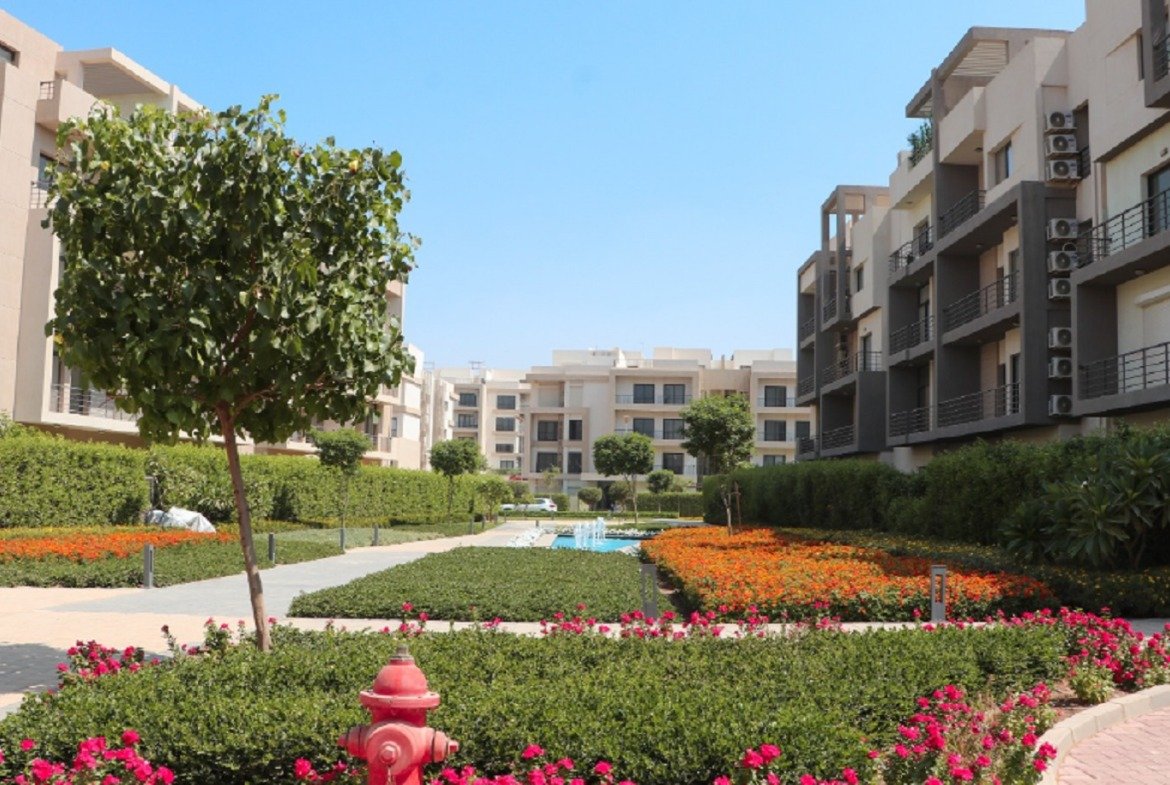Flower beds and apartment buildings - apartment in Fifth Square, New Cairo