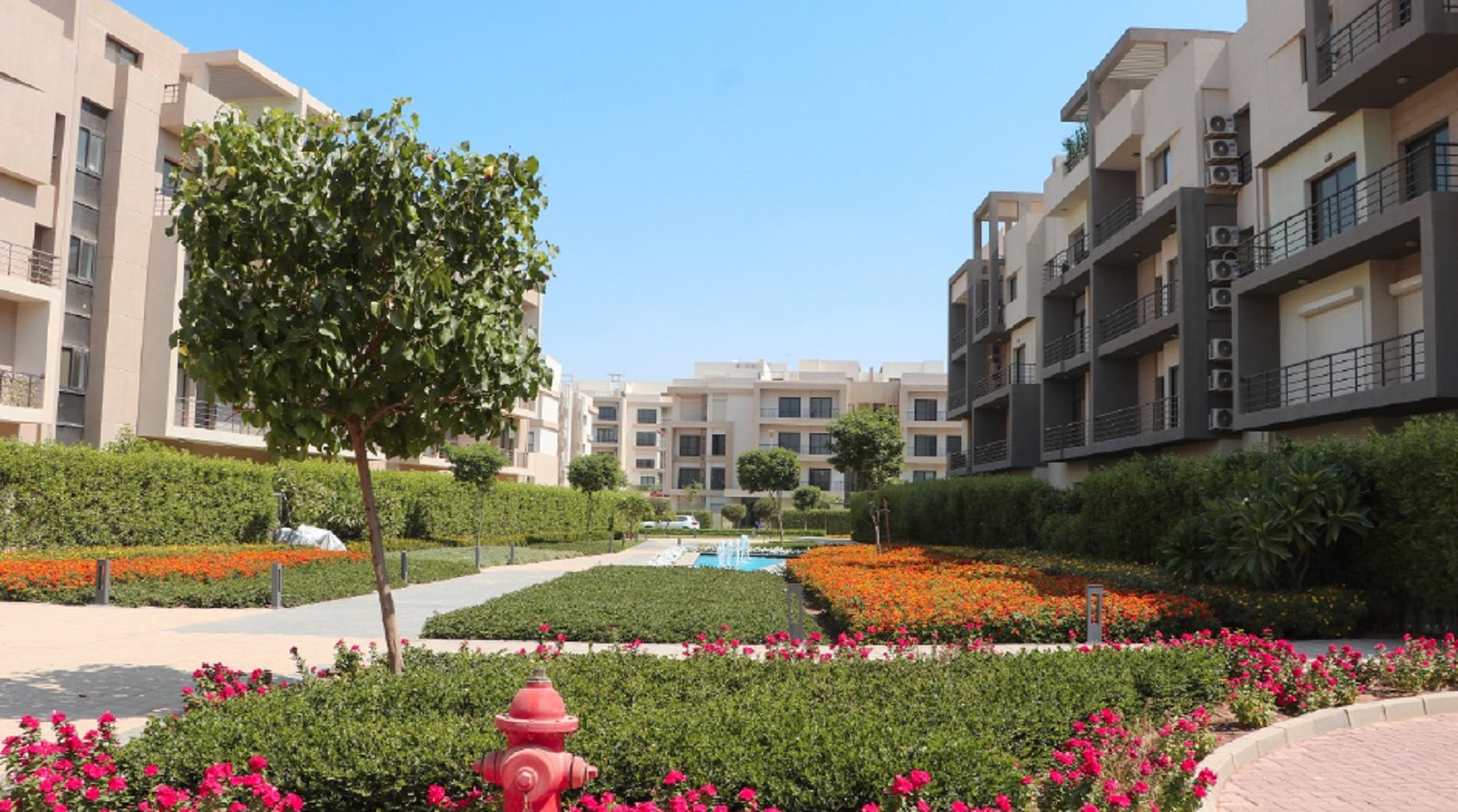 Flower beds and apartment buildings - apartment in Fifth Square, New Cairo