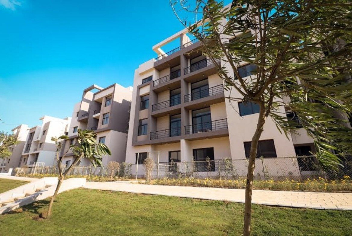 Apartment building with balconies and garden path - apartment in Fifth Square, New Cairo