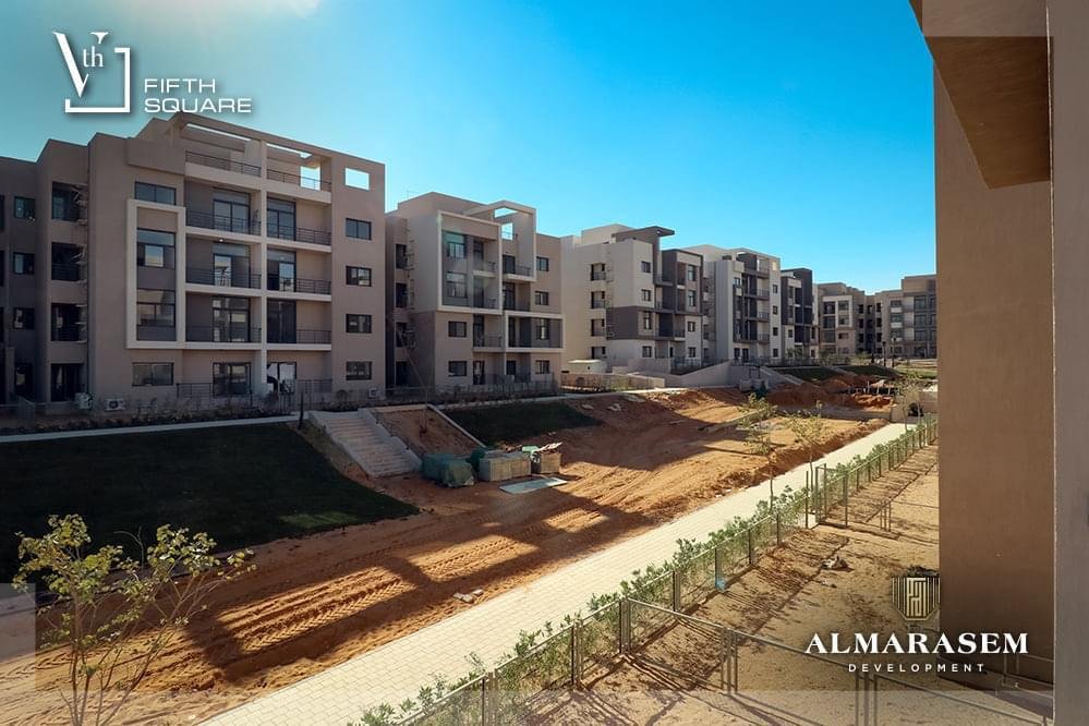Garden slope beside the apartment buildings - apartment in Fifth Square, New Cairo