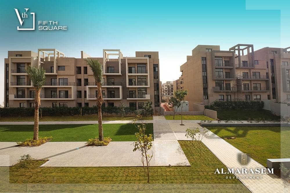 Paved paths and lawn in the compound - apartment in Fifth Square, New Cairo