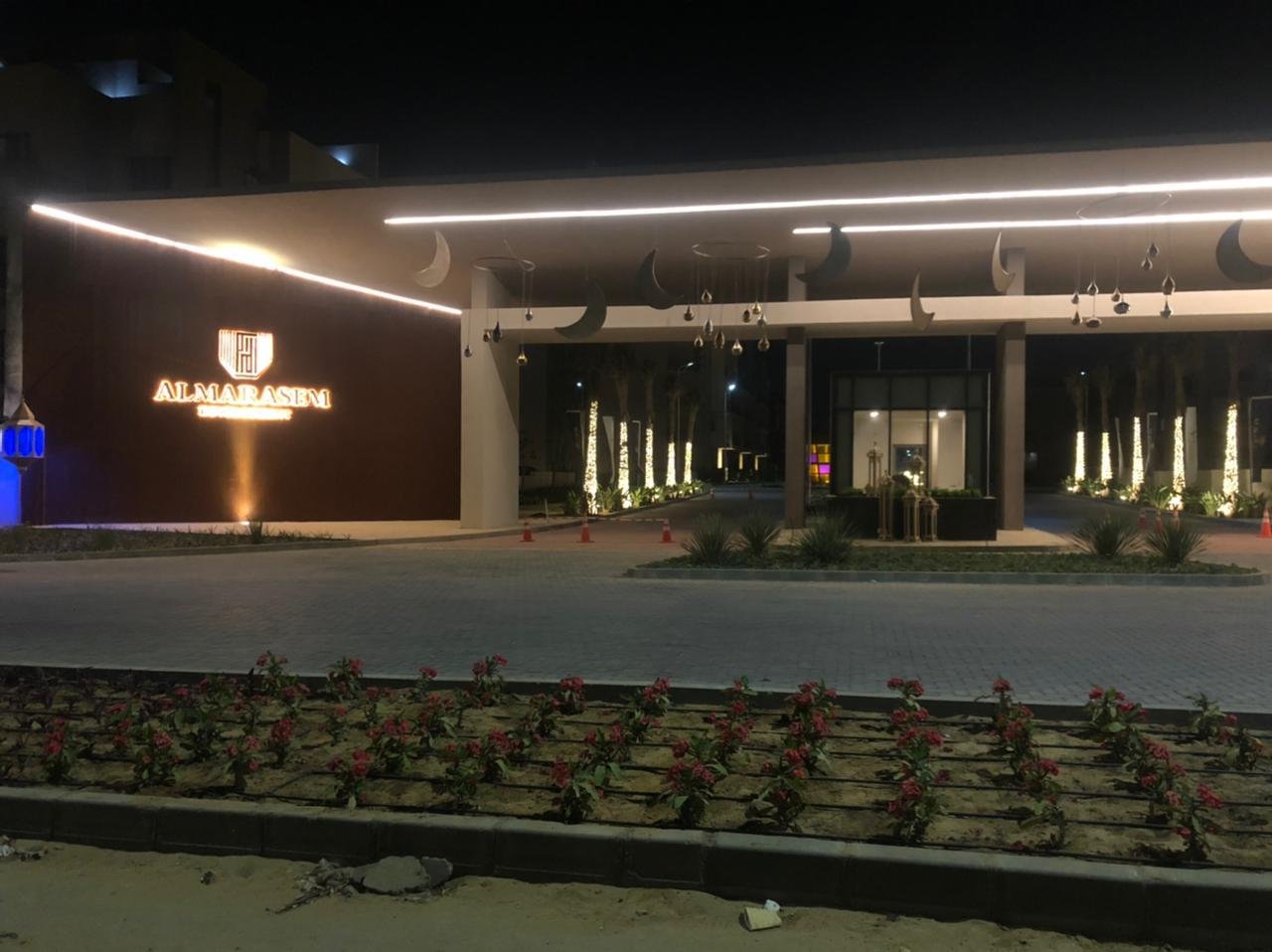 Compound entrance lit at night - apartment in Fifth Square, New Cairo