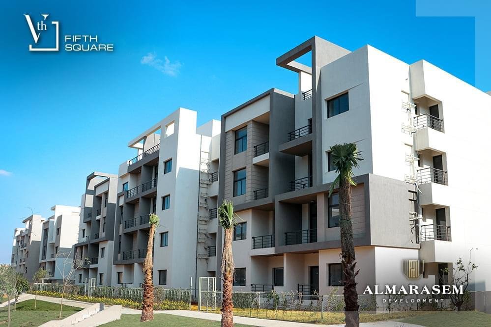 Apartment buildings with balconies and palm trees - apartment in Fifth Square, New Cairo