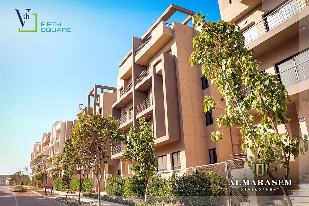 Apartment buildings along the paved street - apartment in Fifth Square, New Cairo