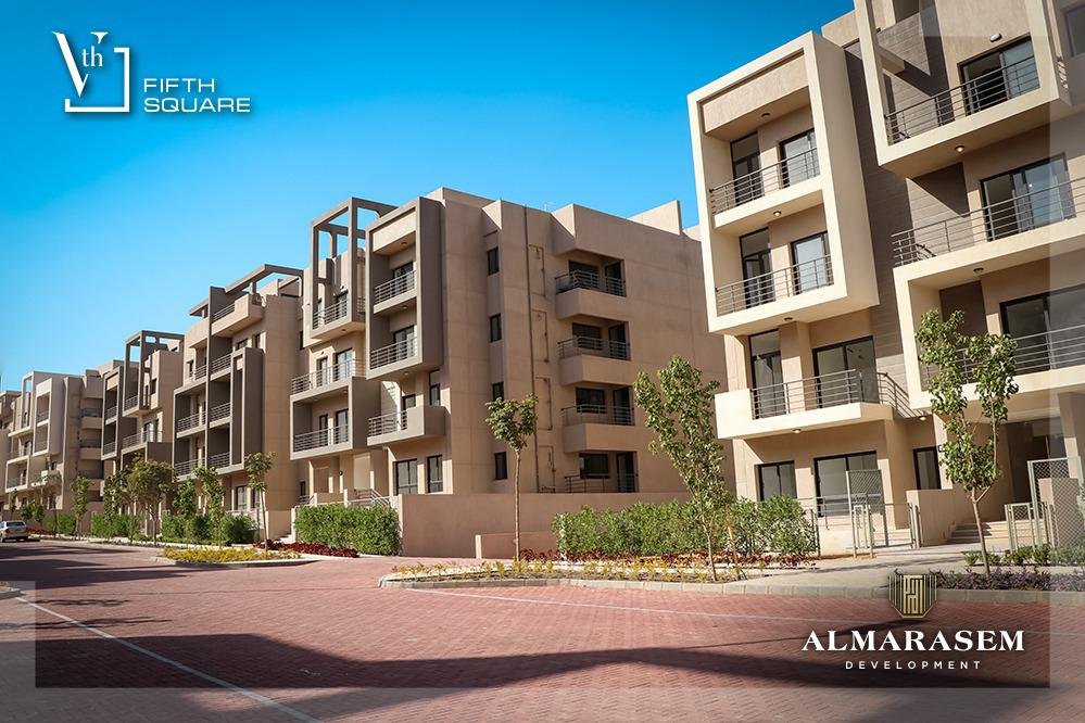 Apartment buildings and paved street - apartment in Fifth Square, New Cairo