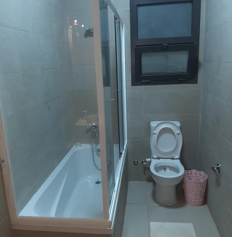 Bathroom with bathtub and toilet - apartment in Fifth Square, New Cairo