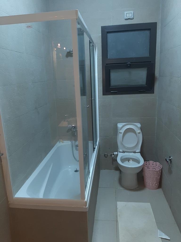 Bathroom with bathtub and toilet - apartment in Fifth Square, New Cairo