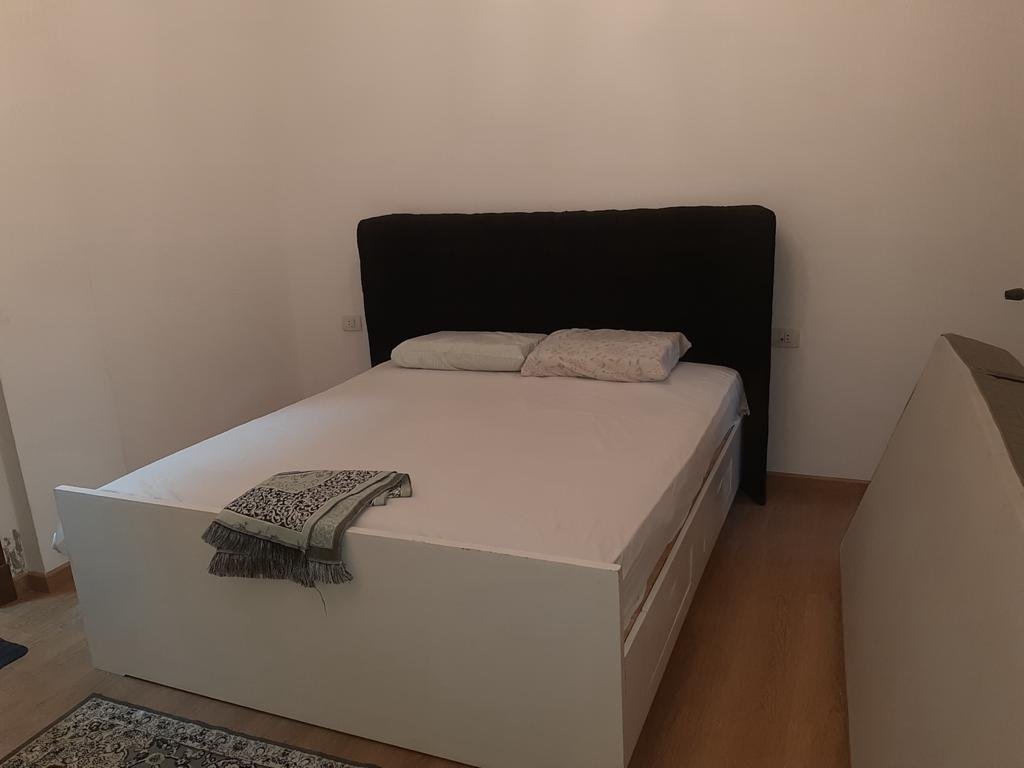 Bedroom with double bed and dark headboard - apartment in Fifth Square, New Cairo