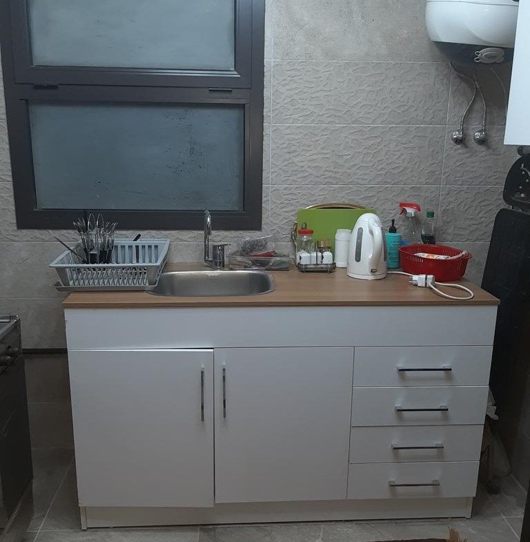 Kitchenette with sink and white cabinets - apartment in Fifth Square, New Cairo