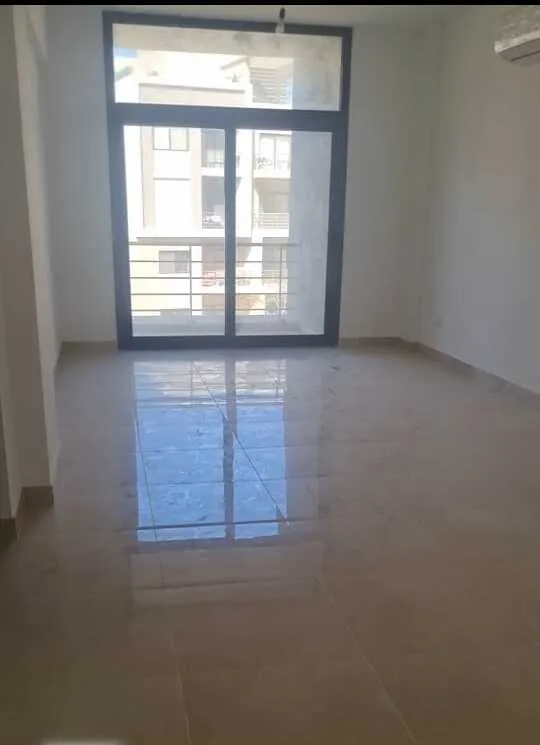 Reception with balcony door and air conditioner in 3 bedroom apartment for rent in Fifth Square New Cairo