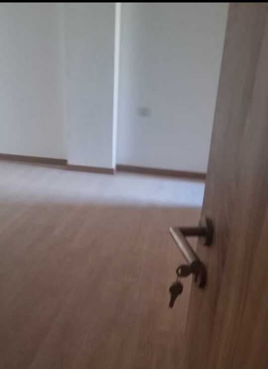 Empty room with wooden door - apartment in Fifth Square, New Cairo