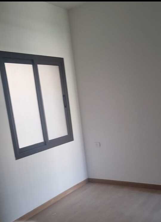Empty room with window - apartment in Fifth Square, New Cairo